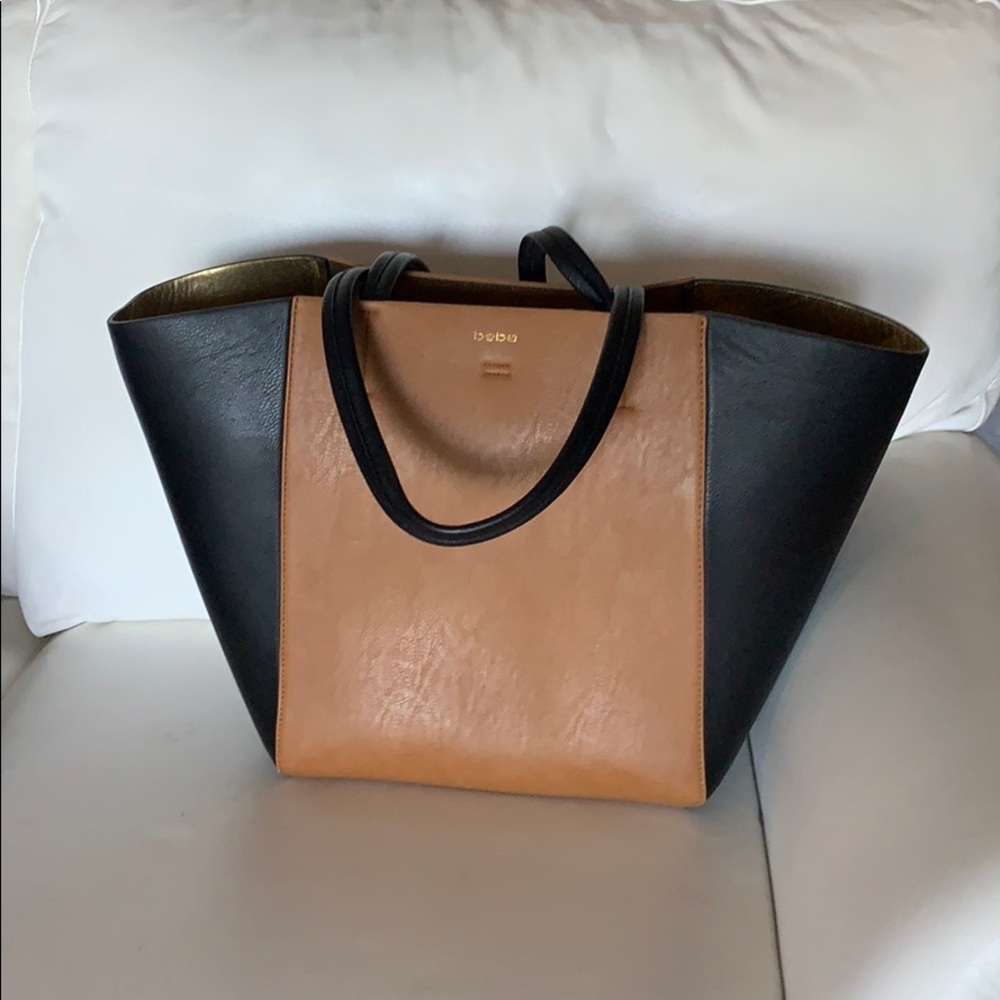 Bebe Black & Tan Handbag With small blemish on black side panel.